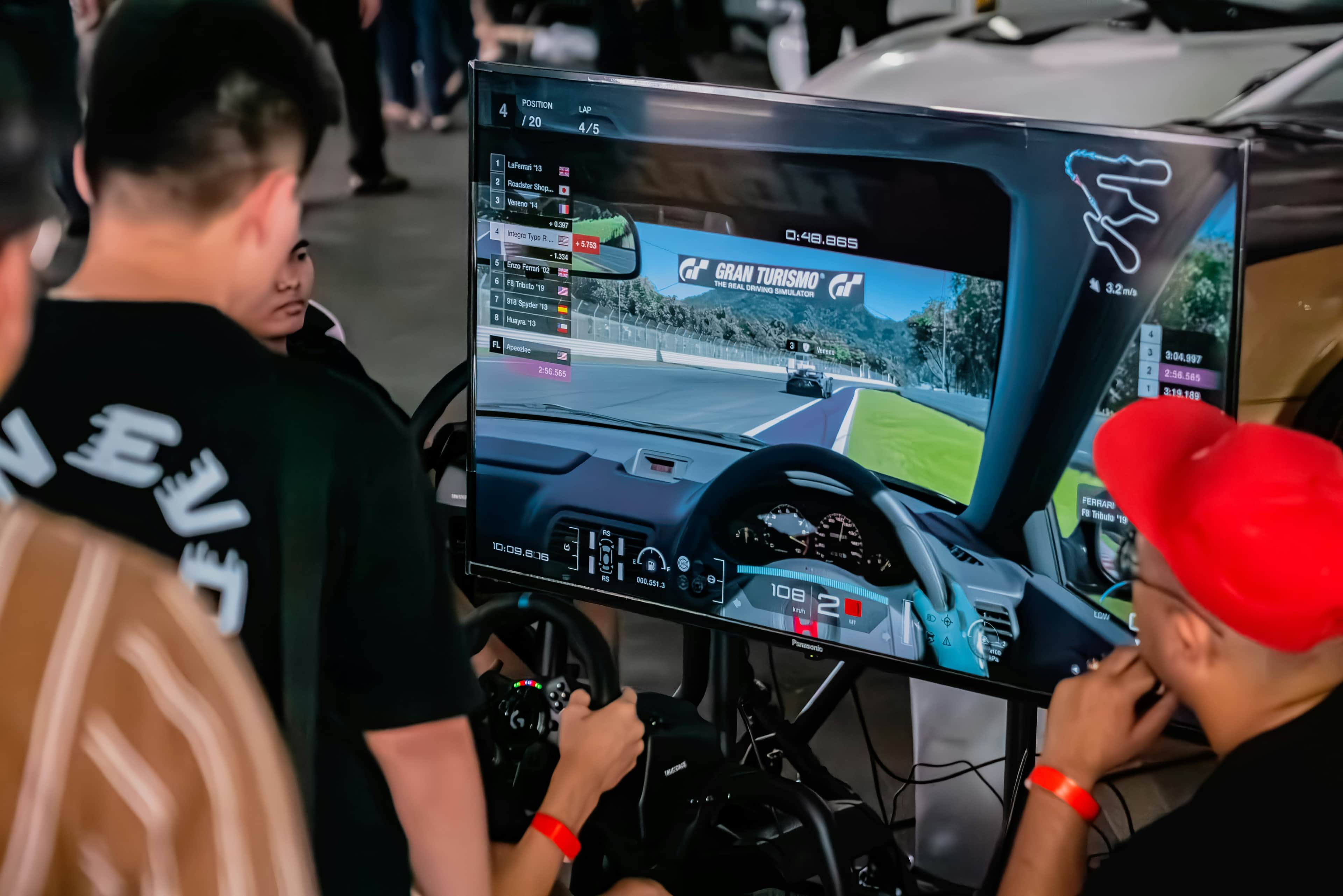 Race engineer reviewing telemetry data on multi-monitor workstation
